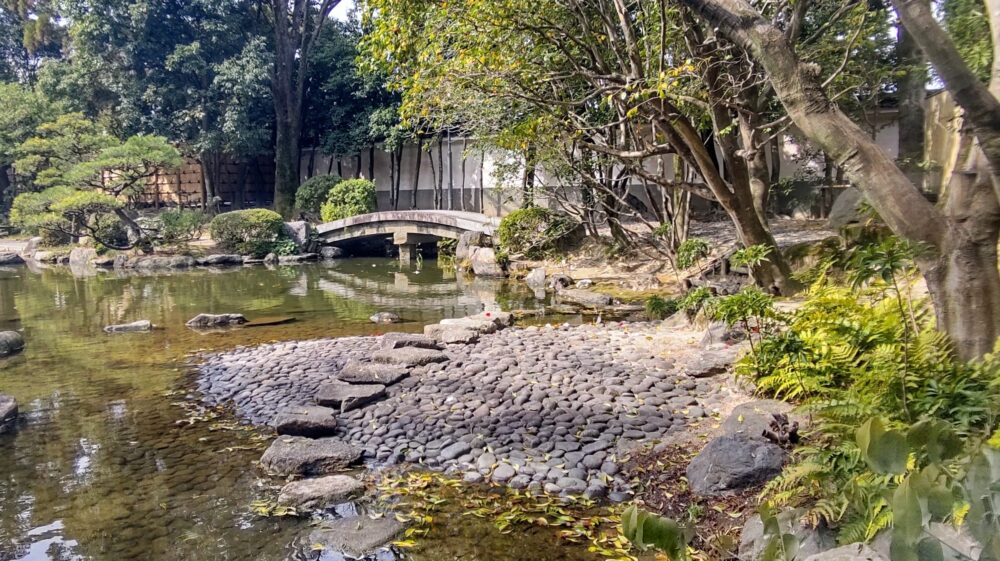 The pebble beach in Ohori park Japanese garden, example of Japanese pond garden