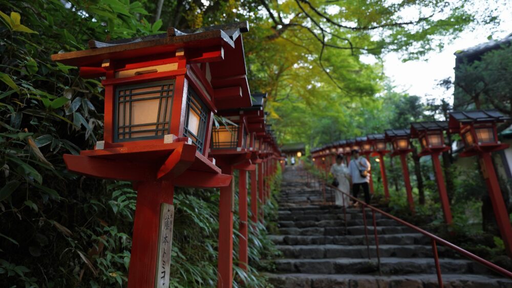 A spiritual view whose is vermilion color lanterns along the main shrine front path of stairs.